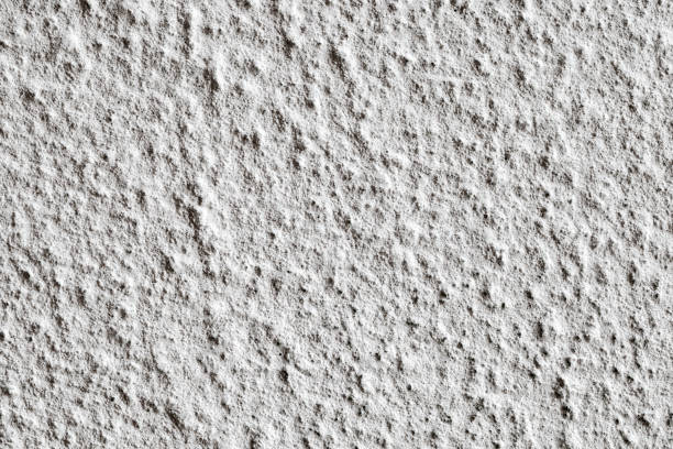 istock Plastered rough grey wall with lumps, close-up, uniform texture background 1652939019