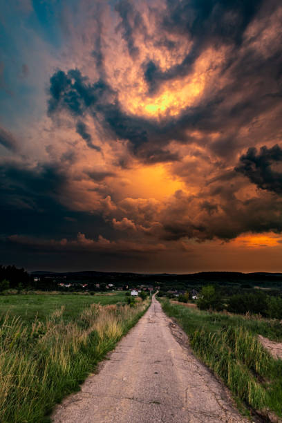 istock Thunderstorm over meadows with dark sky and big cumulonimbus thundercloud and rain 1652949332