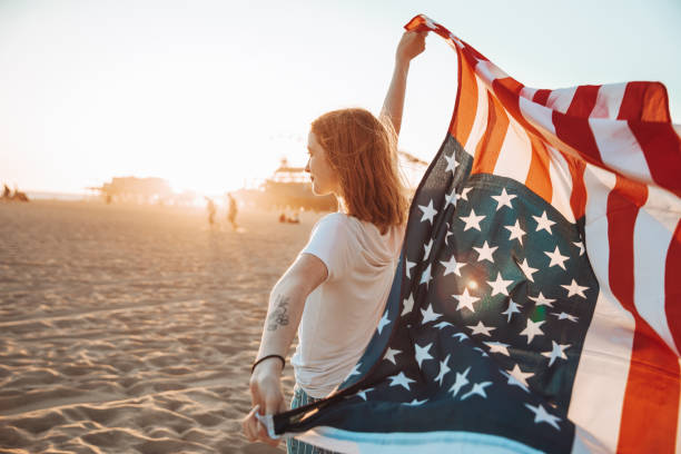 Beautiful young woman by the beach