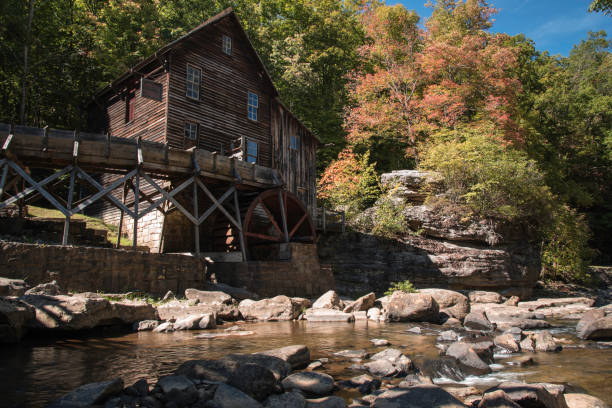 istock Old grist mill on a bright day in early autumn. 1652979098