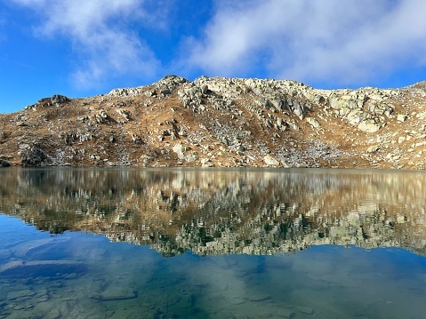 14. A crystal clear alpine lakes Laghi d'Orsirora during a beautiful autumn day in the mountainous area of the St. Gotthard Pass (Gotthardpass), Airolo - Canton of Ticino (Tessin), Switzerland