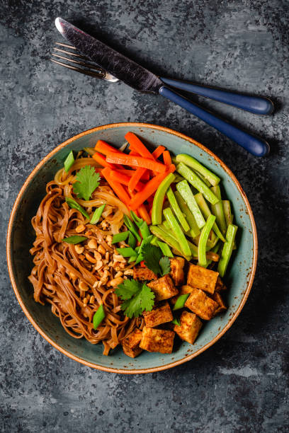 istock Soba noodles with vegetables and fried tofu in a bowl. 1653007622