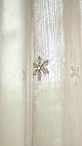 istock Ornamental embroidery in white old curtains 1653064508