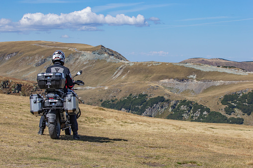 Transalpine, Romania - September 2022: lone motorcyclist at the high mountains