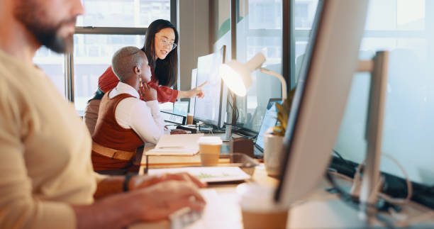 istock Training, human resources and coaching with a female manager and colleague working together in the office. Teamwork, management and review with a business woman talking to a coworker at work 1653093939