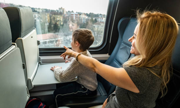istock mom and son ride the train 1653101726