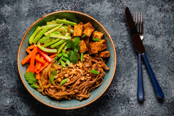 istock Soba noodles with vegetables and fried tofu in a bowl. 1653102251