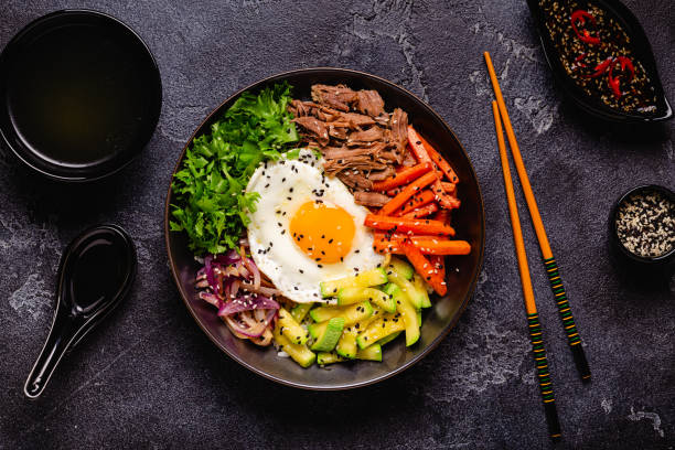 istock Traditional Korean dish Bibimbap: rice with vegetables beef and egg. 1653132762