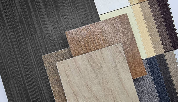 istock variety of interior material samples including wooden ceramic tiles, walnut veneer, catalog of drapery fabric in beige and blue tone. close up view of selected interior construction samples. 1653133826