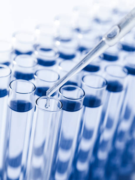 istock Droplet Falling from Pipette into Test Tube. 1653135462
