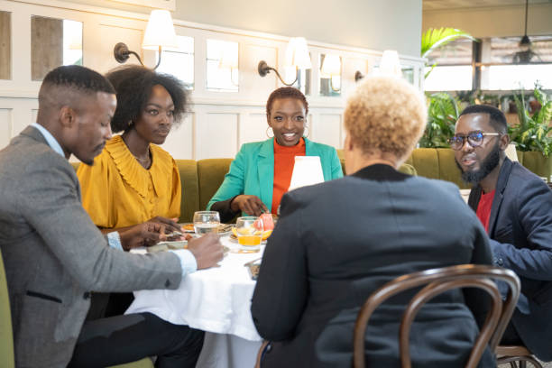 istock Mixed age range enjoying business lunch in restaurant 1653139809