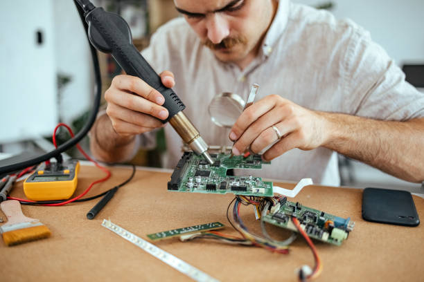 istock Technician repairing motherboard 1653142416