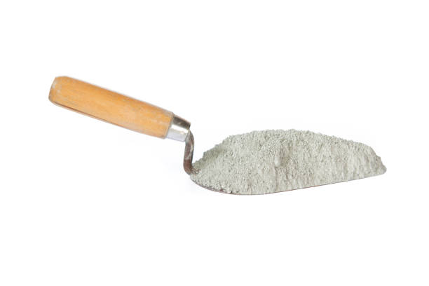 Trowel and cement pile isolated on white with cliping path