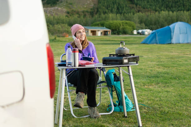 istock Young woman on camping telephoning 1653146661