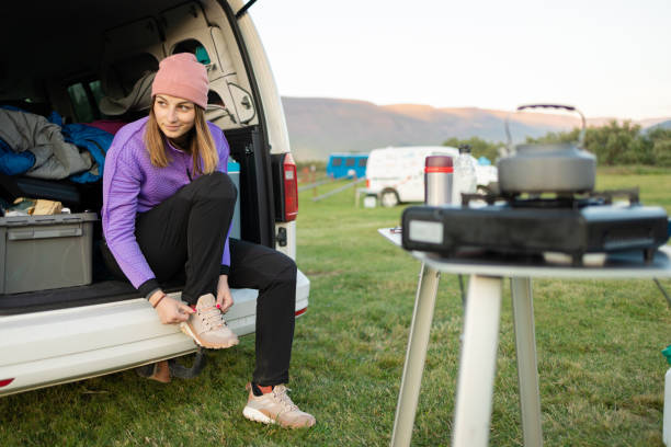 Girl on camping preparing for a hike
