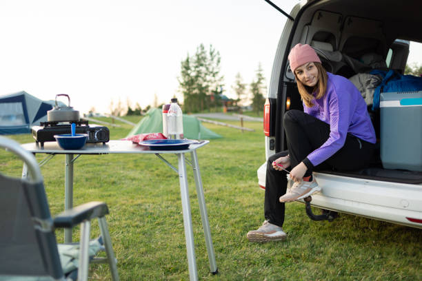 istock Girl on camping getting ready for a hike 1653147217