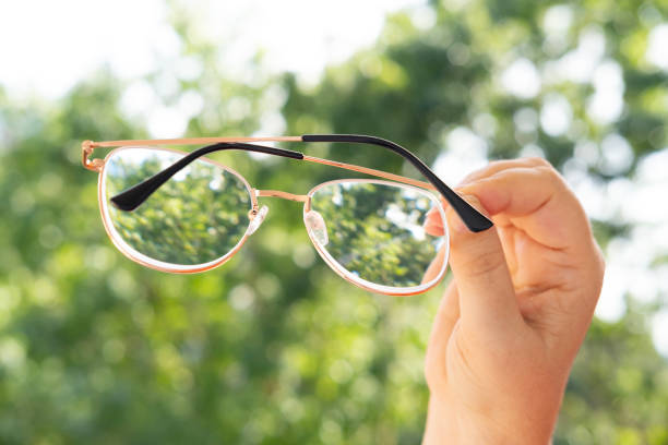 istock glasses with thin metal frame in female hands, individuals with poor vision adapt lifestyle choices and habits accommodate visual needs 1653147784