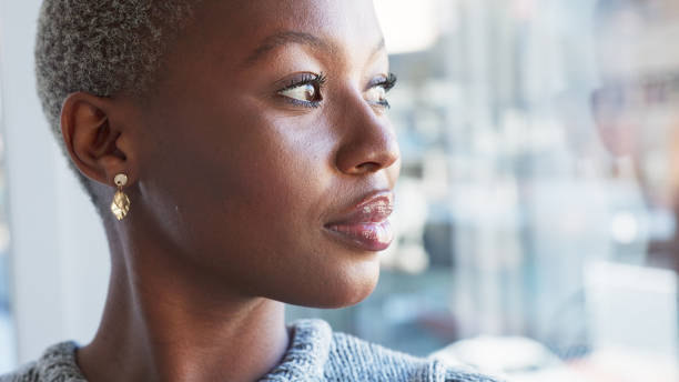 istock Professional black woman thinking while sitting in her office with ideas and planning marketing project. Serious, thoughtful and pensive african business woman working on advertising strategy or plan 1653153046
