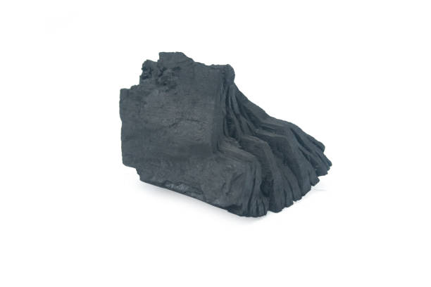 istock Natural wood charcoal Isolated on white 1653154219