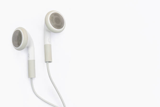 white earphones isolated on white white earphones isolated on white background with clipping path, copy spacewhite earphones isolated on white background with clipping path headphones plugged in photos stock pictures, royalty-free photos & images