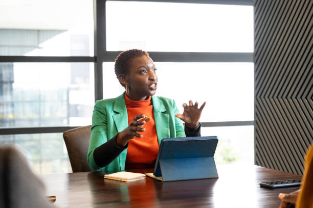 istock Young Black businesswoman sharing ideas during meeting 1653159655
