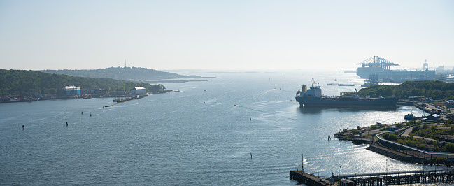 Gothenburg, Sweden - June 05 2023: Afternoon view of the inlet and industrial harbour of Gothenburg.