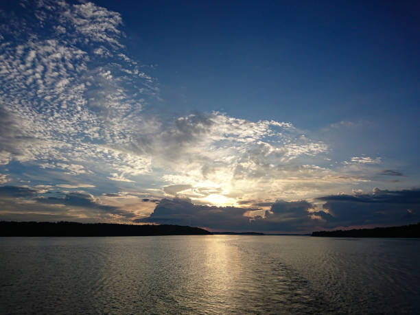 istock Sunset on the sea with clouds in the sky 1653175182