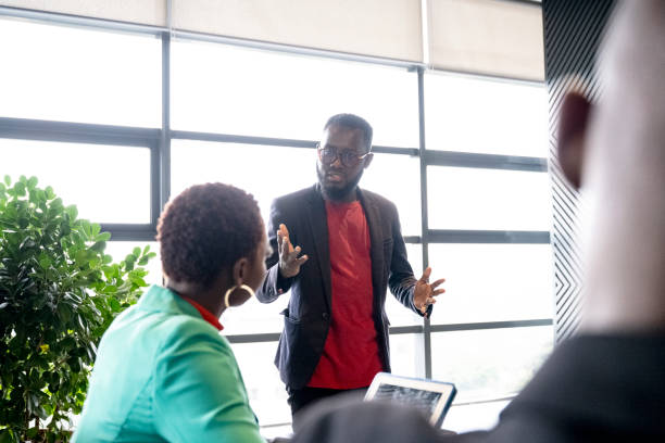 istock East African project manager explaining idea to colleague 1653207444