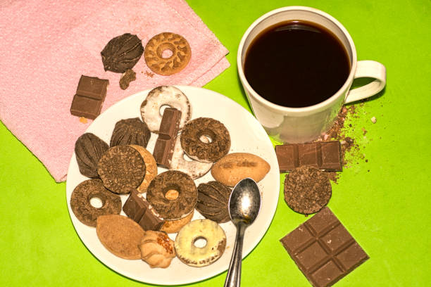 Coffee chocolate and cookies , on the table
