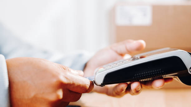 istock Man paying by credit card in shop 1653230960