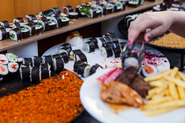 istock Taking delicious sushi from the food bench 1653287105