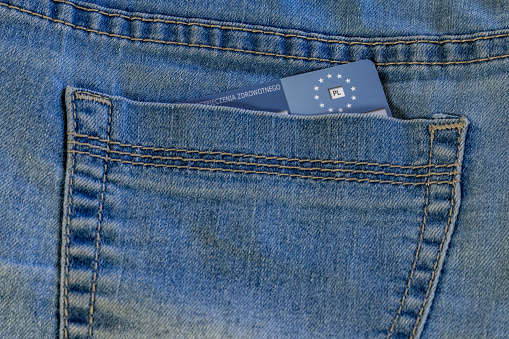 Health insurance card in pocket in blue jeans pants