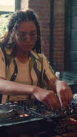 istock Youn Black Female DJ Playing Music Set 1653302032