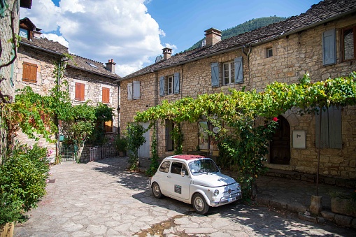 Sainte-Enimie, France - August 22, 2023: Vintage car on a town square