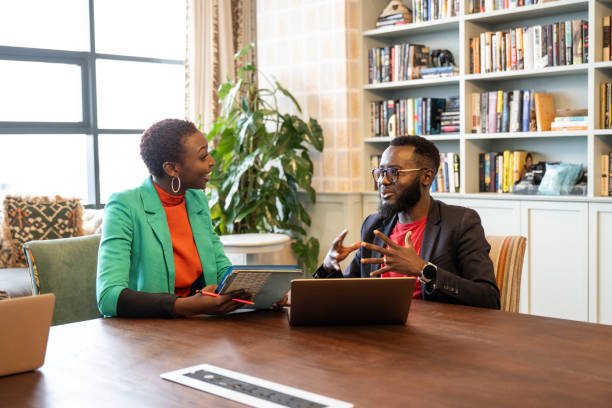 Black business partners discussing plans for new project