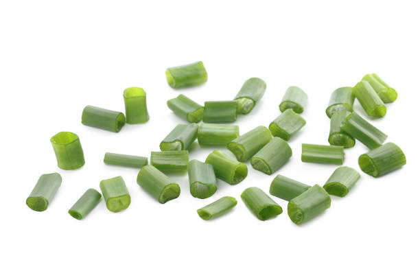 istock Chopped fresh green onions on white background 1653380713