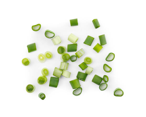 istock Chopped fresh green onions on white background, top view 1653380737