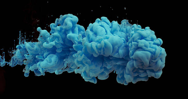 istock Blue Ink entering Water against Black Background 1653387331