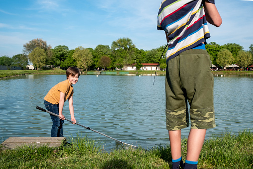 a boys fishing on lake