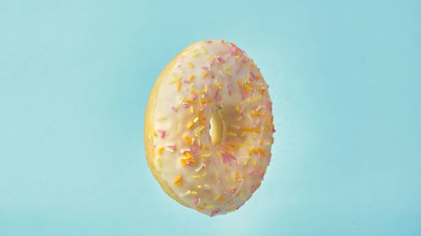 istock donut on a blue background close-up 1653391072