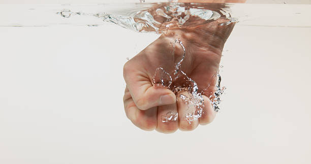 istock Hand of Woman entering Water 1653392176