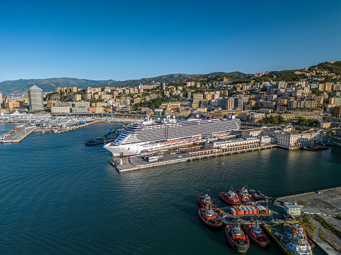 Genoa, Italy- August 7,2023: The drone aerial view of Genoa port and downtown district of the city.
