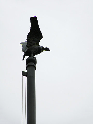 Metallic condor figure on Chilean flag pole