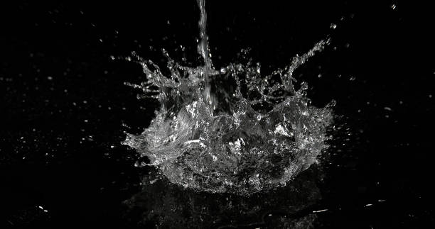istock Water jumping against Black Background 1653420337