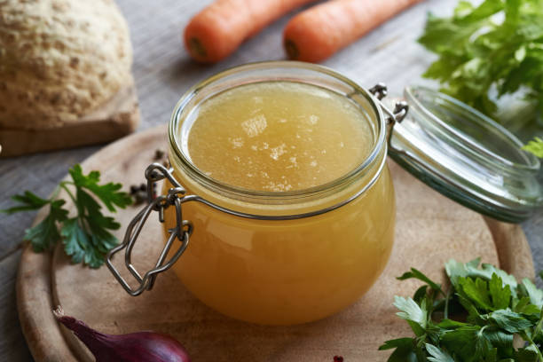 istock Chicken bone broth or soup in a glass jar 1653422603