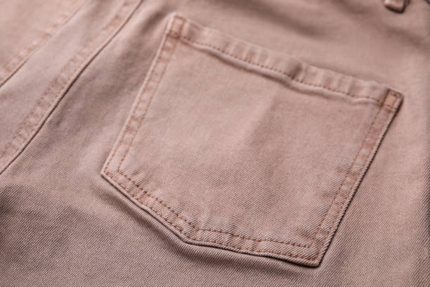 istock Beige jeans with pockets as background, closeup 1653427455