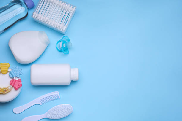istock Flat lay composition with baby care products and accessories on light blue background, space for text 1653427465