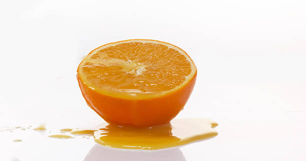 istock Orange, citrus sinensis, Fruit Flowing against White background 1653434560