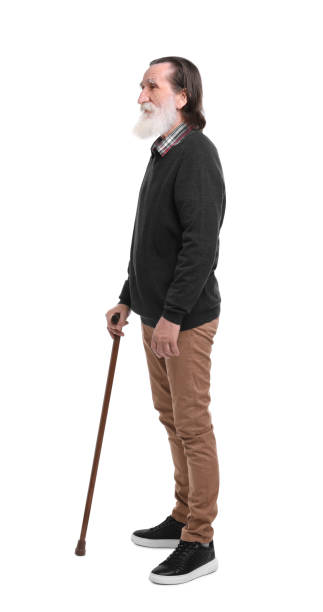 istock Senior man with walking cane on white background 1653452311