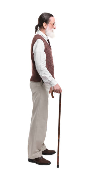 istock Senior man with walking cane on white background 1653452317